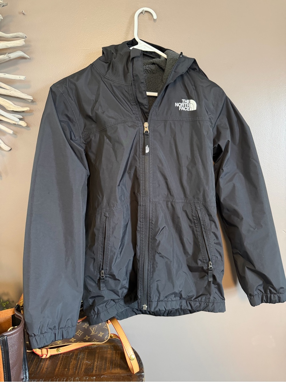 Boys North Face‎ jacket with Sherpa lining in black.  Wind/rain.
